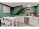 Basement bar featuring white countertop, beverage cooler, and white table with chairs at 2337 S Franklin St, Denver, CO 80210