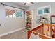 Bright Bedroom room with a charming crib, bookshelf filled with toys, and large windows for natural light at 2337 S Franklin St, Denver, CO 80210