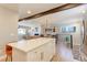 Bright open concept featuring island with seating, stainless appliances, and open layout to the living areas at 2337 S Franklin St, Denver, CO 80210