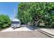 Backyard with concrete pad, mature shade tree and space to park an Airstream trailer or other vehicles at 892 S Union Blvd, Lakewood, CO 80228