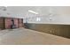 The finished basement features a wood burning stove, paneled walls, and built-in shelving at 892 S Union Blvd, Lakewood, CO 80228