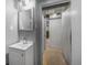 The bathroom features a sink, mirror, and a hallway to the rooms at 892 S Union Blvd, Lakewood, CO 80228