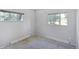 This bedroom features two windows offering natural light and a cozy atmosphere at 892 S Union Blvd, Lakewood, CO 80228