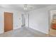 Spacious bedroom featuring a ceiling fan and access to an en-suite bathroom at 892 S Union Blvd, Lakewood, CO 80228
