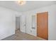 This bedroom offers a spacious area and includes a closet door with a mirror at 892 S Union Blvd, Lakewood, CO 80228