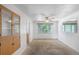 Spacious dining room featuring a ceiling fan, mirror and window with ample natural light at 892 S Union Blvd, Lakewood, CO 80228