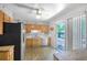 Functional kitchen with wood cabinets, stainless steel appliances, and ample counter space at 892 S Union Blvd, Lakewood, CO 80228