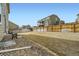 Large backyard with wood fence and potential for landscaping at 13341 Olive St, Thornton, CO 80602