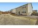 Backyard featuring a patio area, dry grass and a classic wooden fence at 13341 Olive St, Thornton, CO 80602