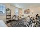 Stylish living room with a neutral palette, featuring comfortable seating, elegant decor, and a cozy ambiance at 13341 Olive St, Thornton, CO 80602