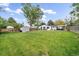 Expansive backyard featuring a well-manicured lawn, patio with seating, shed, and a privacy fence, perfect for outdoor living at 2865 S Cherry Way, Denver, CO 80222
