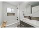 Modern bathroom boasting subway tile, sleek fixtures, and a built-in niche for decor at 2865 S Cherry Way, Denver, CO 80222