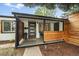A modern style porch with privacy screening and a cozy seating area at 2865 S Cherry Way, Denver, CO 80222