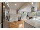 Open concept kitchen with stainless steel appliances, granite countertops, and hardwood floors at 2865 S Cherry Way, Denver, CO 80222