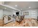 Comfortable living room featuring hardwood floors, neutral tones, a fireplace, and natural light at 2865 S Cherry Way, Denver, CO 80222