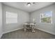 Well-lit office space featuring plush carpet, a sleek desk, comfortable chair, and plenty of natural light at 2865 S Cherry Way, Denver, CO 80222