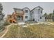 A beautiful blue home with a large deck and patio area, perfect for outdoor entertaining and relaxation at 3063 E 148Th Pl, Thornton, CO 80602