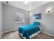 Comfortable bedroom featuring neutral walls, plush carpet, and a cozy blue quilt on the bed at 3063 E 148Th Pl, Thornton, CO 80602