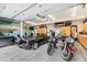 Spacious garage with epoxy flooring, storage cabinets, and room for multiple cars and motorcycles at 3063 E 148Th Pl, Thornton, CO 80602