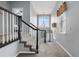 Hallway with carpeted stairs and a decorative chandelier at 3063 E 148Th Pl, Thornton, CO 80602