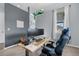 Comfortable home office with a large desk, ergonomic chair, and natural light at 3063 E 148Th Pl, Thornton, CO 80602