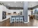 Modern kitchen featuring stainless steel appliances, white cabinets, and a center island with seating at 3063 E 148Th Pl, Thornton, CO 80602