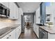 Modern kitchen with stainless steel appliances, granite countertops, and ample cabinet space at 3063 E 148Th Pl, Thornton, CO 80602