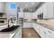 Modern kitchen with stainless steel appliances, granite countertops, and ample cabinet space at 3063 E 148Th Pl, Thornton, CO 80602