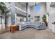 Open-concept living room with soaring ceilings and abundant natural light at 3063 E 148Th Pl, Thornton, CO 80602