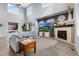 Spacious living room featuring high ceilings, fireplace, and large windows at 3063 E 148Th Pl, Thornton, CO 80602