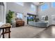 Spacious living room featuring high ceilings, fireplace, and multiple windows at 3063 E 148Th Pl, Thornton, CO 80602