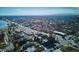 An aerial view of a neighborhood featuring modern apartments, traditional homes, and nearby commercial areas at 5128 W 26Th Ave # 208, Denver, CO 80212