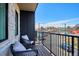 Cozy balcony with comfortable seating and city view, perfect for relaxing outdoors at 5128 W 26Th Ave # 208, Denver, CO 80212