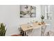 Cozy dining area highlighted by a wooden table, stylish chairs, and contemporary artwork at 5128 W 26Th Ave # 208, Denver, CO 80212