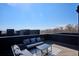 Relaxing rooftop deck featuring comfortable seating and a stylish outdoor rug, ideal for enjoying scenic views at 5128 W 26Th Ave # 208, Denver, CO 80212