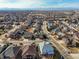 High aerial view of the neighborhood, showcasing the well-planned layout and surrounding landscape at 8775 Wild Horse Way, Frederick, CO 80504