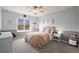 Relaxing bedroom with calming colors, a window, and bedside table at 8775 Wild Horse Way, Frederick, CO 80504