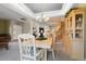 Bright dining area with a chandelier, a stairway view, and a large hutch at 8775 Wild Horse Way, Frederick, CO 80504