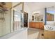 Bathroom featuring a glass shower, tiled flooring, double vanity with a soaking tub at 8775 Wild Horse Way, Frederick, CO 80504