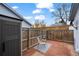 Fenced backyard featuring brick pavers, a storage shed, and minimal landscaping at 16120 E Radcliff Pl, Aurora, CO 80015