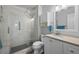 Modern bathroom with tiled walk-in shower, vanity and storage cabinet at 16120 E Radcliff Pl, Aurora, CO 80015