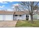 Charming single-story home with a well-manicured lawn and a mature tree in a quiet community at 16120 E Radcliff Pl, Aurora, CO 80015