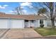 Charming one story home with a well-manicured lawn and attached one car garage at 16120 E Radcliff Pl, Aurora, CO 80015