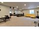 Spacious finished basement with recreation, seating, and entertainment areas at 26554 E Indore Ave, Aurora, CO 80016