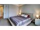 Spacious bedroom with neutral walls, a queen-sized bed, and side tables with lamps at 26554 E Indore Ave, Aurora, CO 80016