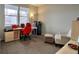 Bright room showcasing a practical layout with a work desk and sitting area at 26554 E Indore Ave, Aurora, CO 80016
