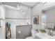 Modern bathroom with a walk-in shower and gray vanity at 12293 W Saratoga Ave, Morrison, CO 80465