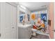 Basement bathroom with a shower/tub combo and gray vanity at 12293 W Saratoga Ave, Morrison, CO 80465