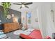 Cozy bedroom with a wooden bed frame and colorful decor at 12293 W Saratoga Ave, Morrison, CO 80465