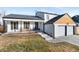 Updated two-story home with a modern facade, two-car garage, and inviting front porch at 12293 W Saratoga Ave, Morrison, CO 80465